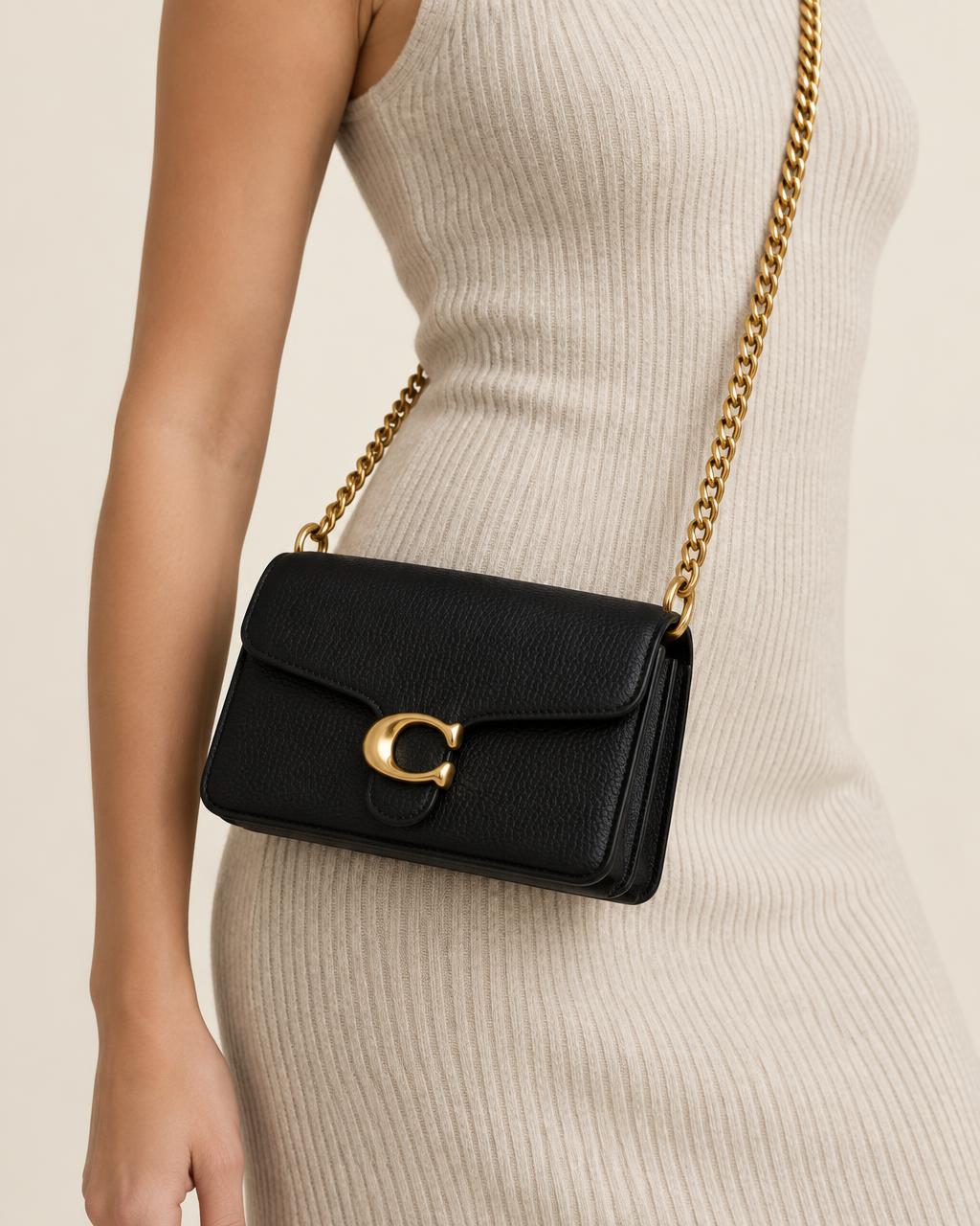 Tabby 19 bag worn across the body on the chain strap